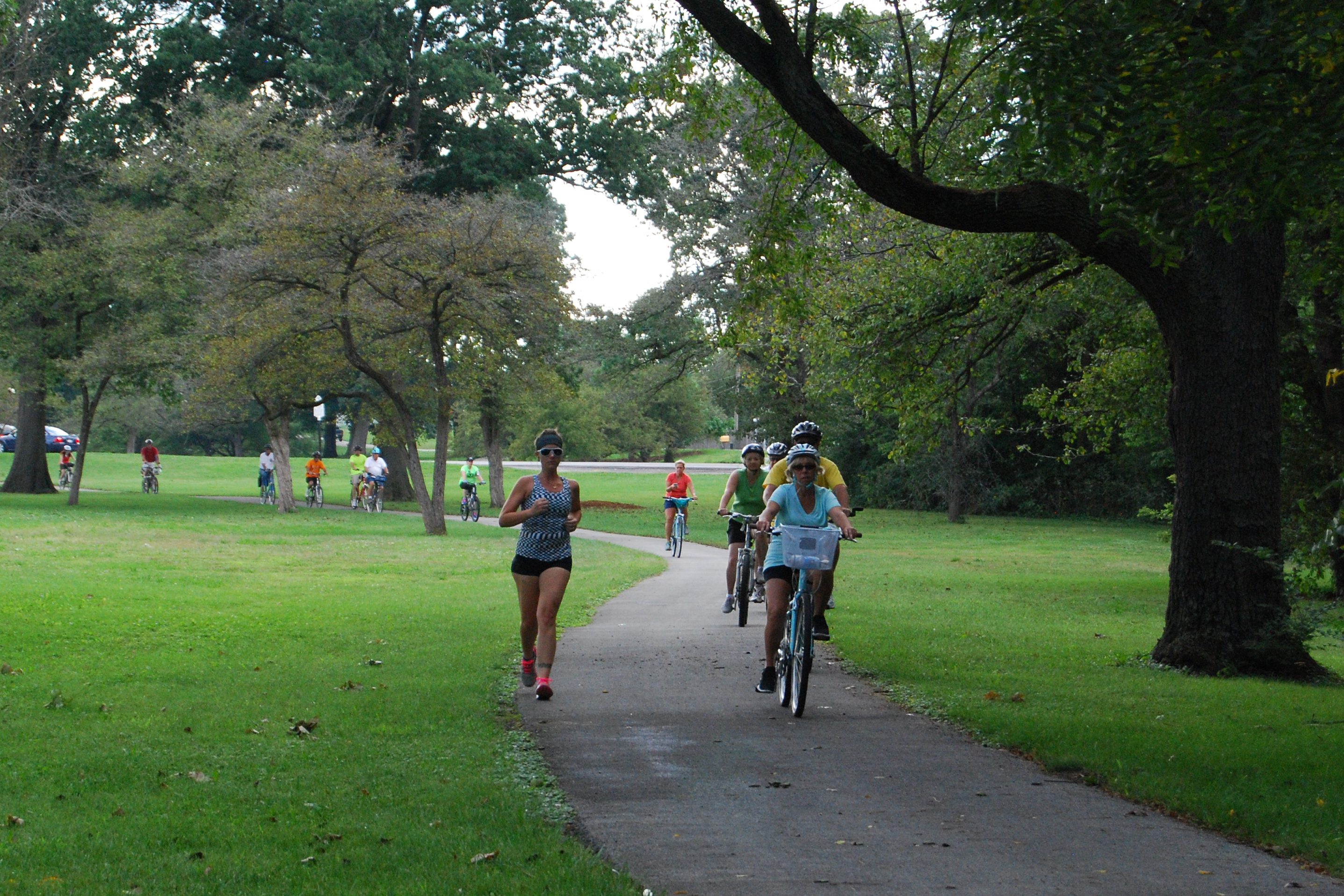 Bicyclists and joggers on trail